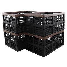 three black plastic crates stacked on top of each other with holes in the bottom and sides