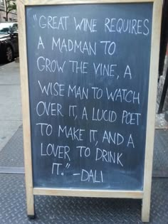 a chalkboard sign with writing on it that says great wine requires a madman to grow the vine, a wise man to watch over it, a liquid pot to make it, and a lover to drink