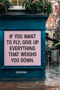 a sign that says if you want to fly give up everything that weighs you down