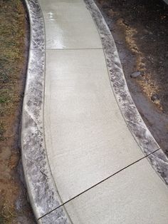 a skateboarder is going down a concrete ramp