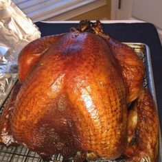 a whole turkey sitting on top of a cooling rack