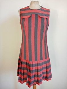 A very interesting 1960s sleeveless dress with chest pocket motif. Rare and like new. Low-waisted with red and blue stripes and pleated skirt. Lined. Really nice. Measurements: shoulders 35 cm, bust 46 cm, length 87 cm. #modaanni60s #vintage60sdress #stripes #rossoandblue #lowlife #carnabystreet #beat Interesting Dress, Vintage Dress 60s, Carnaby Street, 60s Dress, Low Waisted, Vintage 60s, Low Waist, Dress Clothes For Women, Chest Pocket