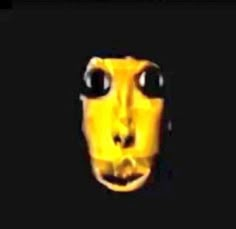 an animated yellow face with big eyes and large black eyes is shown in the dark