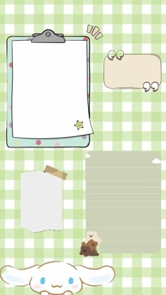 a green checkered background with paper, teddy bear and other items to write on