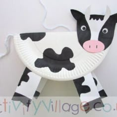 a paper plate shaped like a cow