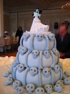 a wedding cake made to look like it has skulls all over the bottom and sides