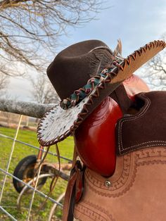 Wanting to add a little something on your hat?!?  This is the place for you! I can put hair on hide onto the brim of your hat, Just like the one in the pictures. And they're all uniquely different because the leather isn't all the same.   we will supply the hat, just send us your hat size , color and style.  pricing veries on what hat you pick  $190 and so on  can get better shipping prices than Etsy.  Done in the USA Custom Brown Hat Bands For Ranch, Handmade Western Felt Hat For Ranch, Western Handmade Felt Hat For Ranch, Custom Brown Felt Hat For Ranch, Custom Leather Hat Bands For Western-themed Events, Custom Brown Felt Hat For Western-themed Events, Artisan Leather Hat For Rodeo, Artisan Leather Hat Bands For Western-themed Events, Artisan Leather Hat For Western-themed Events