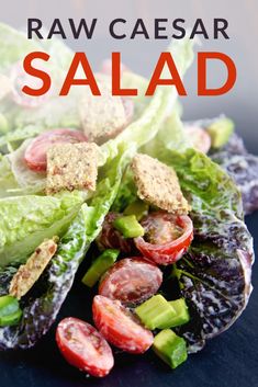 lettuce, tomato and cucumber salad with text overlay reading raw caesar salad