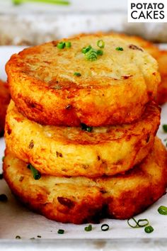 some food is stacked on top of each other in a white plate with green sprouts