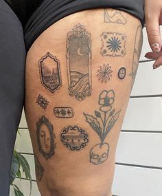 a woman's thigh with tattoos on it