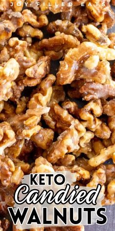 a pile of candied walnuts on top of a wooden table with the words, keto candied walnuts