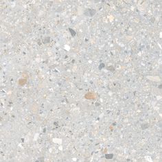 an image of a white and grey surface with small rocks on it's sides