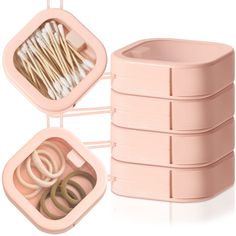 two pink containers with rings and forks in them