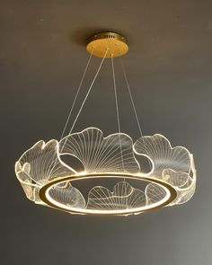 a circular chandelier hanging from the ceiling