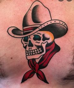 a skull wearing a cowboy hat with a red scarf around it's neck is shown