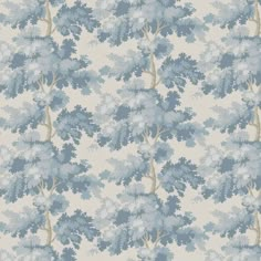 a blue and white wallpaper with trees on it