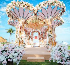 an outdoor wedding setup with flowers and petals