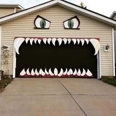 a garage with a large monster's mouth painted on it