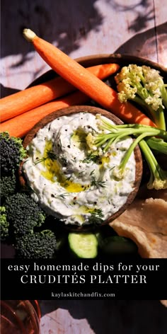 some carrots and broccoli on a plate with dip