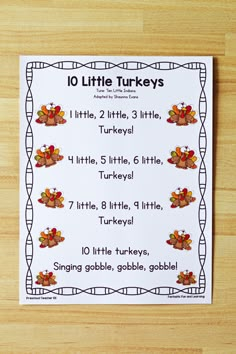 a printable ten little turkeys game on a wooden table