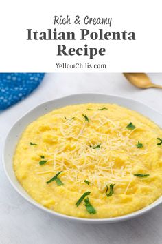 a white bowl filled with yellow grita and topped with parmesan cheese