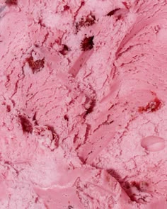 a scoop of pink ice cream in a bowl