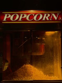 an old popcorn machine is filled with corn