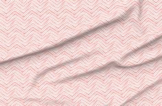 an orange and white fabric with wavy lines on the side, as well as a diagonal pattern