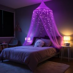 a bed with purple lights on it and a canopy over the headboard is lit up