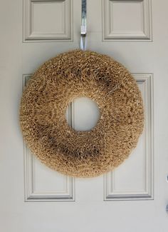 a door with a wreath hanging on it