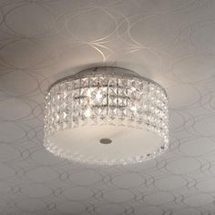 a chandelier hanging from the ceiling in a room