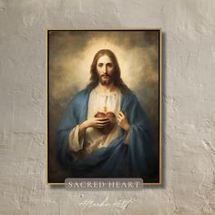 a painting of jesus holding an apple with the words sacred heart above it