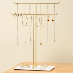 PRICES MAY VARY. Sleek Modern Design: Minimalist metal jewelry stand adds a touch of elegance to any bedroom or entryway decor. Tangle-Free Organization: Two-tier design keeps necklaces and bracelets neatly separated and easy to access. Durable and Sturdy: Crafted from high-quality metal, this stand holds multiple pieces without tipping, ensuring long-lasting use. Non-Slip Base: Specially designed sponge pads on the bottom prevent slipping and protect your surfaces from scratches. Easy Assembly: Quick setup with just two screws—ready for use in minutes without any hassle. Product Description Elevate your jewelry storage with this minimalist, stylish jewelry stand, designed to complement any modern home decor. Whether you're a fashion-forward professional who needs easy access to your neckl Jewelry Holder Stand, Things For My Room, Accessories Organization, Diy Jewelry Holder, Metal Display, Market Stalls, Necklace Holder, Long Necklaces, Design Minimalist