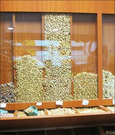 the shelves are filled with different types of nuts