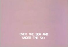 an airplane flying over the sea and under the sky with words written on it in white