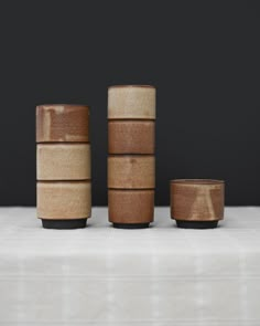 four wooden bowls stacked on top of each other