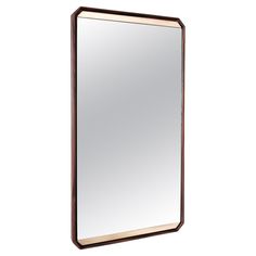 a large mirror sitting on top of a wooden frame