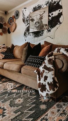 a living room filled with furniture and pictures on the wall