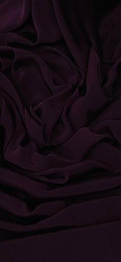 the fabric is very dark purple in color