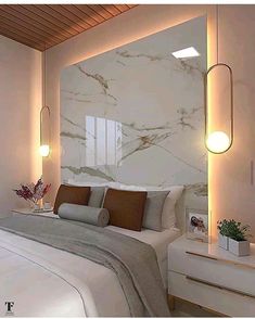 a bedroom with marble walls and white bedding