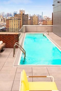 an empty swimming pool on top of a building