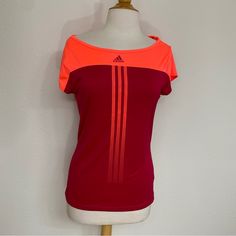 Nwt Adidas Climacool Tennis Work Out Tee. Cute Cutout In The Back. Neon Orange/Pink And Magenta. Workout, Gym, Tennis, Active, Athleisure, Walking, Running, Streetwear, Urban, Summer, Spring, Fall And Winter. Brand New- There’s Some Little Marks That Should Come Out When Washed. Size Medium Pink Sportswear T-shirt For Workout, Adidas Three Stripes Tops For Gym, Athleisure Sports Top With Three Stripes, Short Sleeve Activewear With Three Stripes For Workout, Adidas Logo Sports Top With Short Sleeves, Adidas Short Sleeve Training Tops, Adidas Workout Top With Logo, Adidas Sporty Top For Training, Adidas Casual Tops For Training