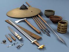 an assortment of kitchen utensils on a blue surface