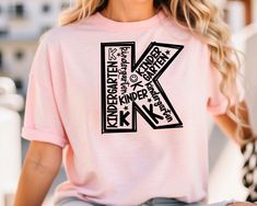 Kindergarten Teacher T-Shirt, Kinder Teacher Shirt,  Grade Level Shirts, Teacher T-Shirts, Kindergarten Squad Crew Tribe Pink Graphic Tee With Heat Transfer Vinyl, Kindergarten Tshirt Ideas, Kindergarten Tshirt, Teacher T Shirts, Kindergarten Teacher, Tshirt Ideas, Kindergarten Teachers, Teacher Tshirts, Teacher Shirts