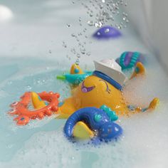 a bathtub filled with toys and water