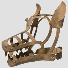 an old metal object with teeth and claws