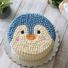 there is a cake decorated with an image of a penguin