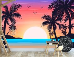 a wall mural with palm trees and the sun setting over the ocean in front of it