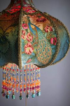 an image of a lamp with beads hanging from it