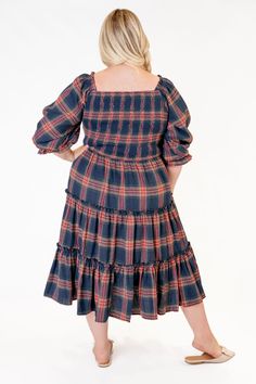 A tried and true Ivy City favorite - The Madeline is back in a NAVY PLAID! Flowy, feminine, and functional. This carefree tea-length dress features a smocked bodice, puff sleeves and ruffle details. Now available in the perfect fall plaid, available in styles for the whole family! Available in sizes xxs - 5x + kids! Tiered Midi Skirt, Navy Floral Dress, Floral Print Midi Dress, Tiered Midi Dress, Tea Length Dresses, Midi Length Dress, Flowy Dress, Smock Dress, Plaid Dress